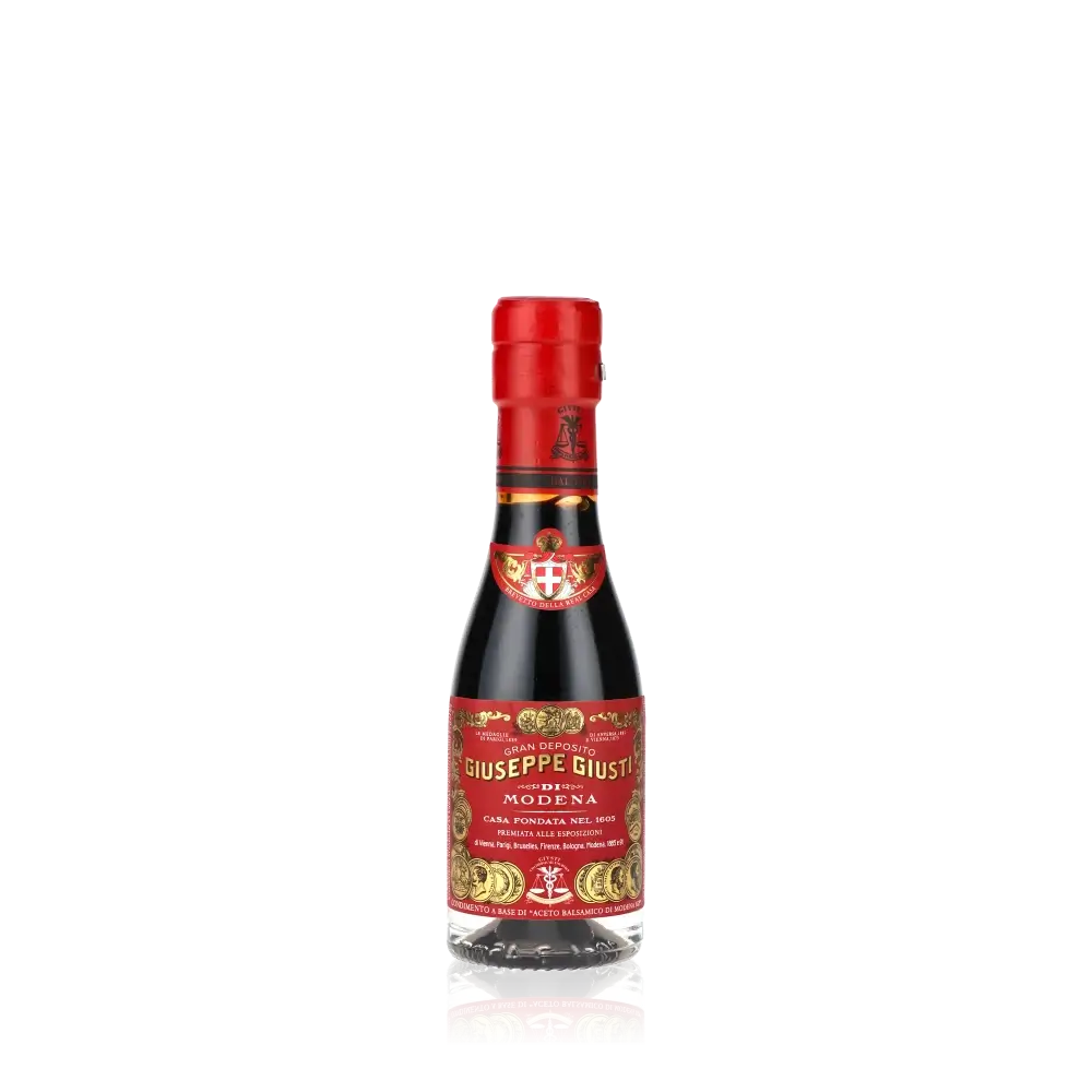 Giuseppe Giusti Balsamico-Essigflasche mit rotem Etikett.