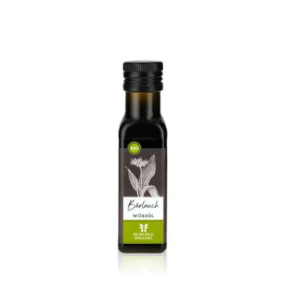 Ölmühle Solling Bärlauch Würzöl Flasche vor schwarzem Hintergrund.