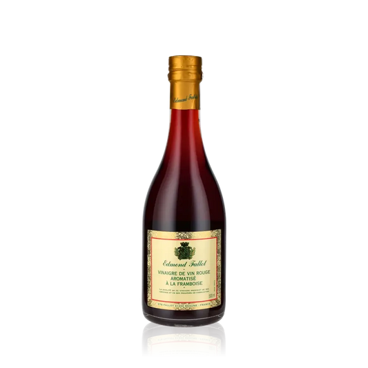 Fallot Rotweinessig mit Himbeere Flasche vor schwarzem Hintergrund.