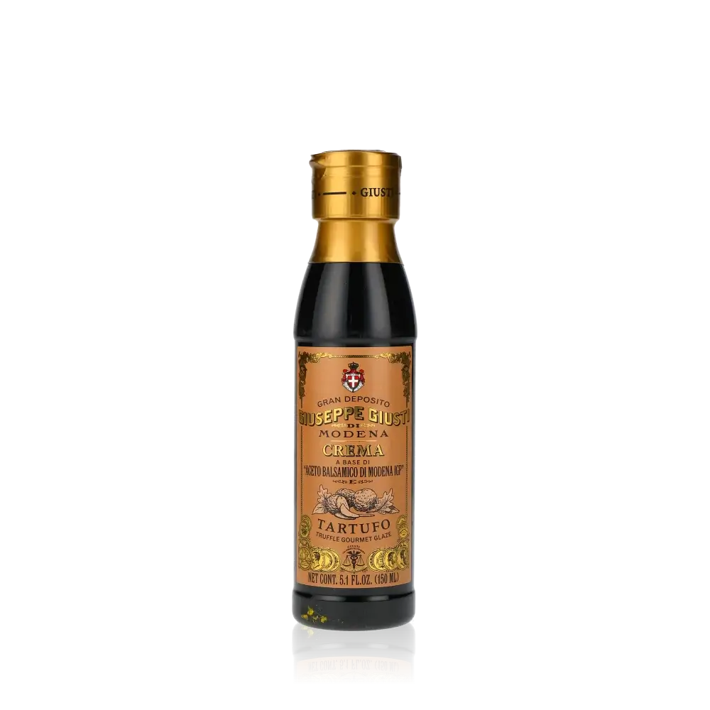Giuseppe Giusti Crema Trüffel Balsamicocreme Flasche vor schwarzem Hintergrund.