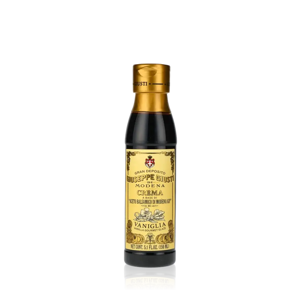 Giuseppe Giusti Crema Vanille Balsamicocreme Flasche vor schwarzem Hintergrund.