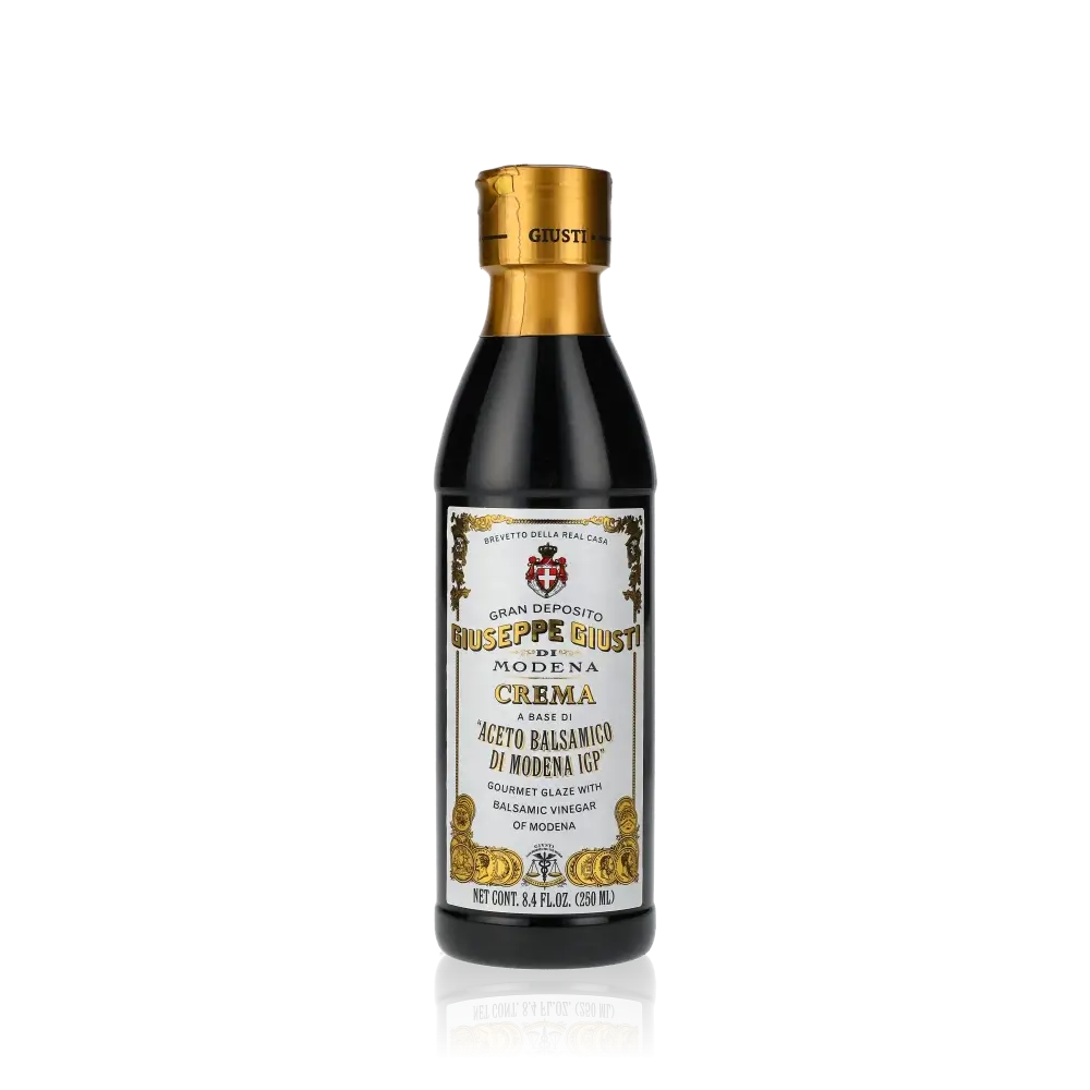 Giuseppe Giusti Balsamico-Creme Flasche auf schwarzem Hintergrund.