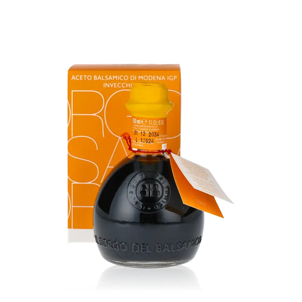 Il Borgo Balsamico Essigflasche mit gelbem Etikett und Verpackung.