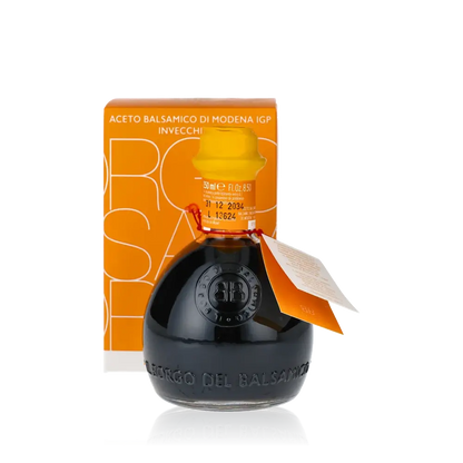 Il Borgo Balsamico Essigflasche mit gelbem Etikett und Verpackung.