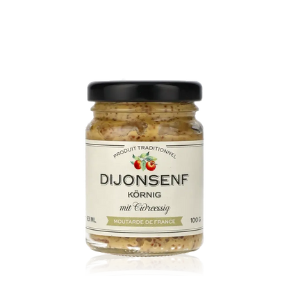 Dijonsenf körnig mit Cidreessig im Glas.