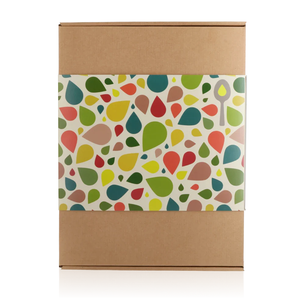 Feinkost Geschenkverpackung mit buntem Tropfenmuster, keine Marken sichtbar.