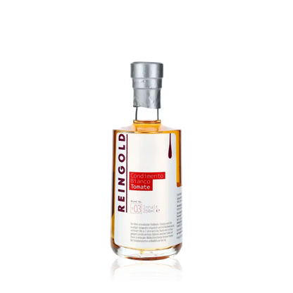 Reingold Condimento Bianco Tomate Flasche vor schwarzem Hintergrund.
