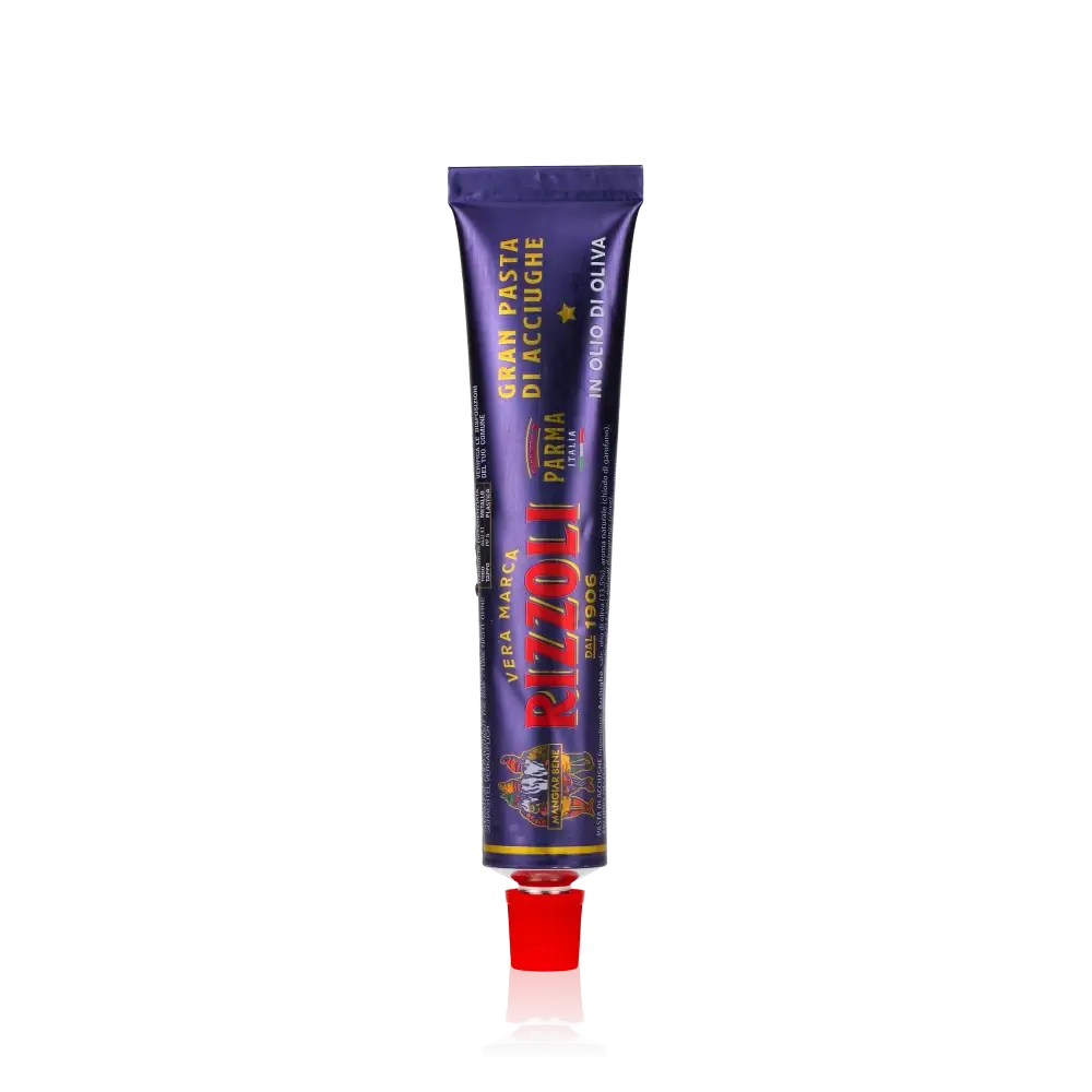 Rizzoli Sardellenpaste Tube auf schwarzem Hintergrund.