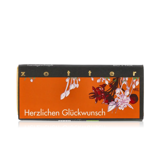 Zotter Schokolade mit "Herzlichen Glückwunsch" Aufschrift, Blumenmotiv.