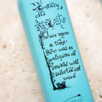 Castillo de Canena geräuchertes Olivenöl Flasche mit Etikett.