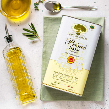 Frantoi Cutrera Olivenöl, Flasche, Löffel, Olivenzweig, Tuch.